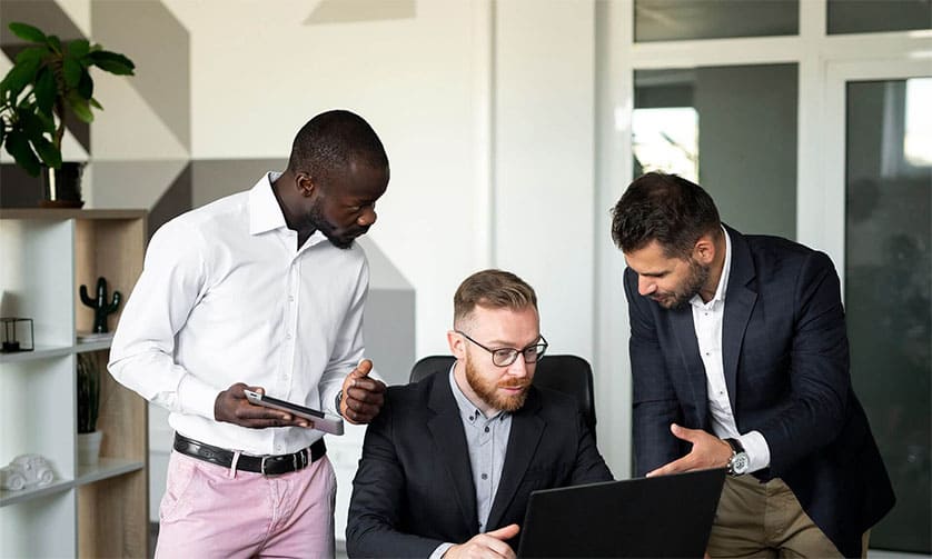 Real estate company team members working together